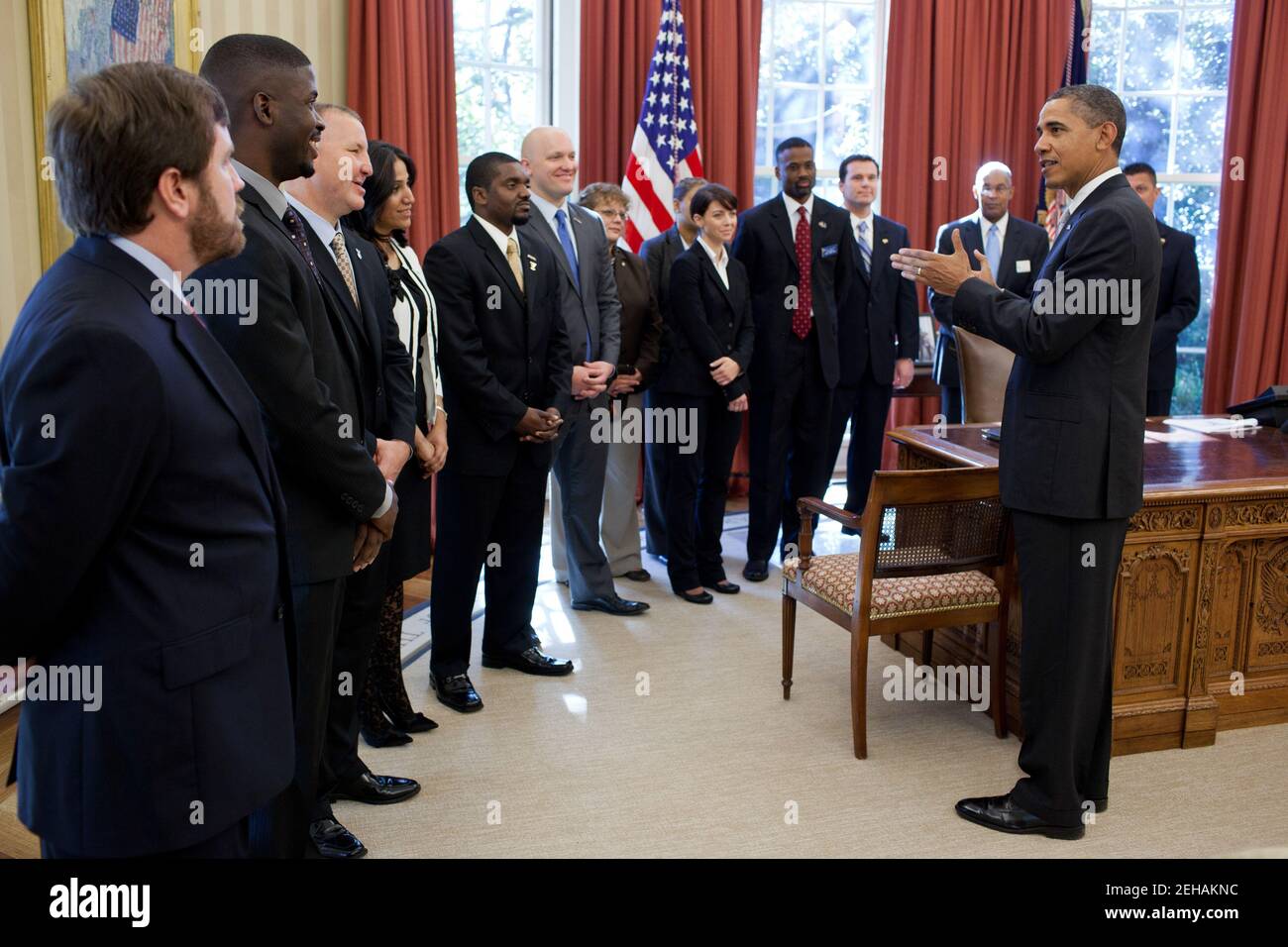 President Barack Obama greets representatives from leading veterans service organizations in the Oval Office before delivering remarks on the American Jobs Act in the Rose Garden, Nov. 7, 2011. The President spoke about tax credits included in the American Jobs Act and new executive actions that will help get veterans back to work. Stock Photo