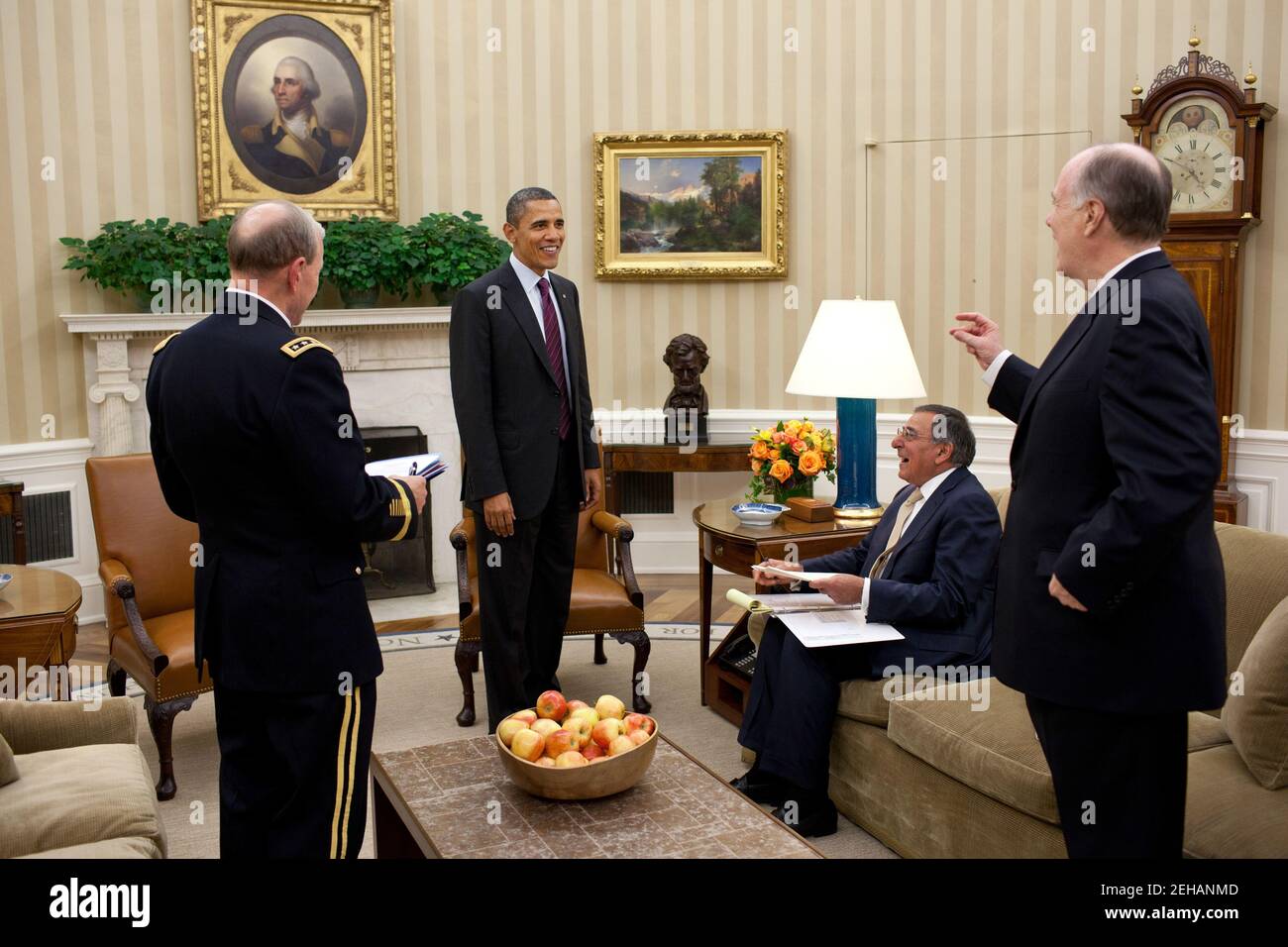 President Barack Obama meets with, from left, Gen. Martin Dempsey, Chairman of the Joint Chiefs of Staff, Defense Secretary Leon Panetta  and National Security Advisor Tom Donilon in the Oval Office, Nov. 22, 2011. Stock Photo