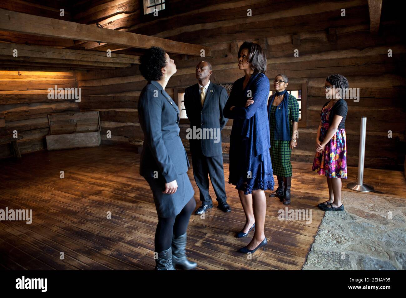 First Lady Michelle Obama views The Slave Pen exhibit while touring the National Underground Railroad Freedom Center in Cincinnati, Ohio, Feb. 23, 2012. Pictured, from left, are: Dina Bailey, Associate Curator of the National Underground Railroad Freedom Center; Cincinnati Mayor Mark Mallory; Verna Williams; and Allison Singleton. Stock Photo