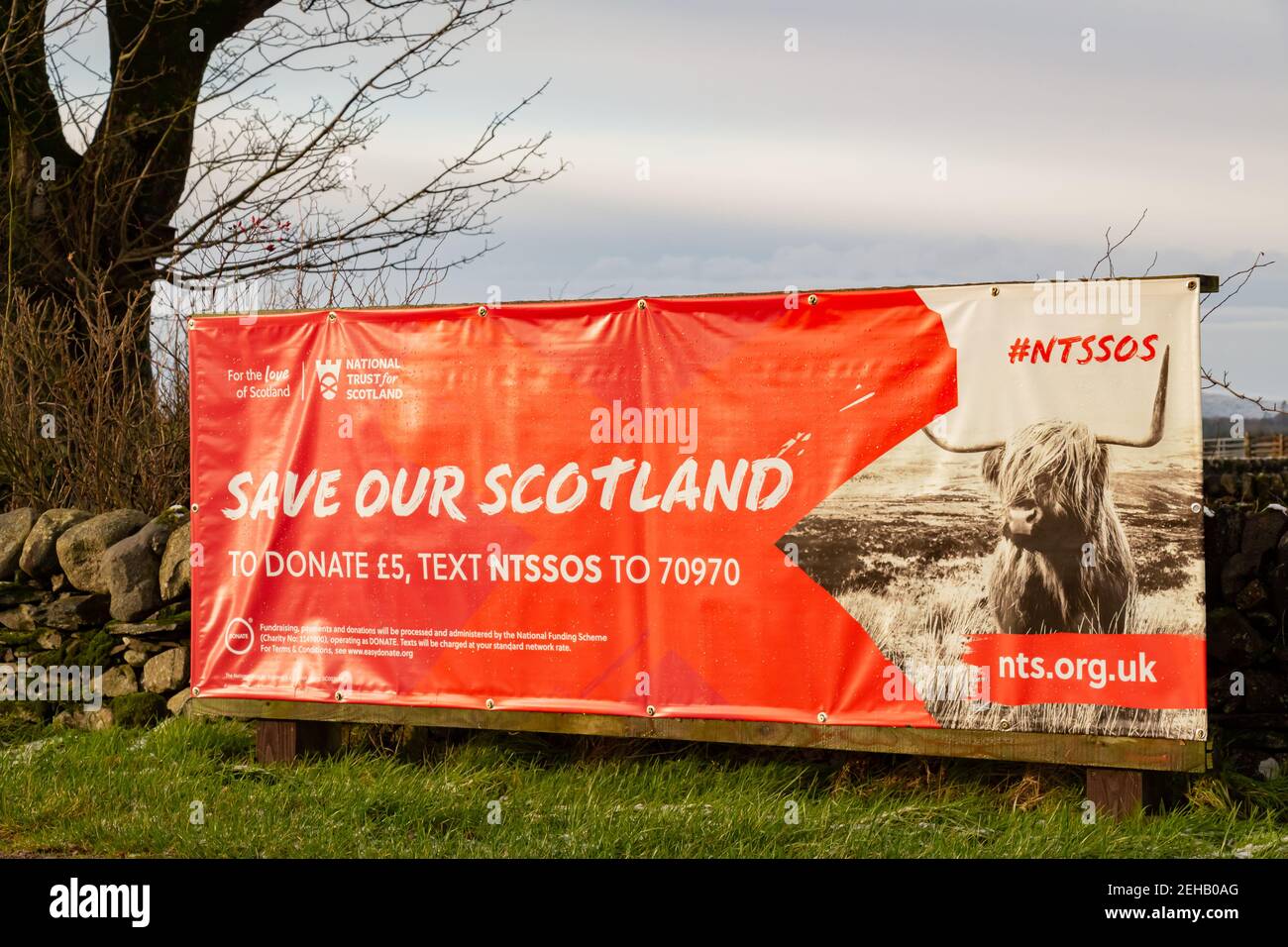 Castle Douglas, Scotland - 27th December 2020: Close up of the Save our Scotland, National Trust for Scotland campaign banner at Threave Castle, Castl Stock Photo