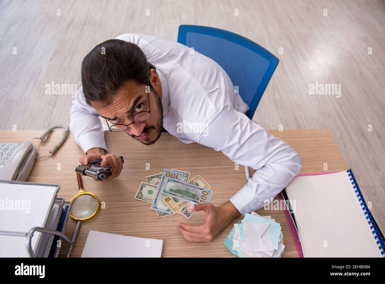 Angry bookkeeper in bankruptcy concept Stock Photo - Alamy