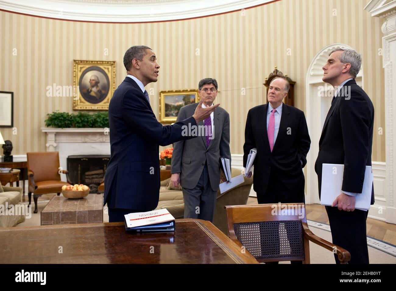 President Barack Obama talks with Chief of Staff Jack Lew, National Security Advisor Tom Donilon, and Deputy National Security Advisor Denis McDonough in the Oval Office, March 16, 2012. Stock Photo