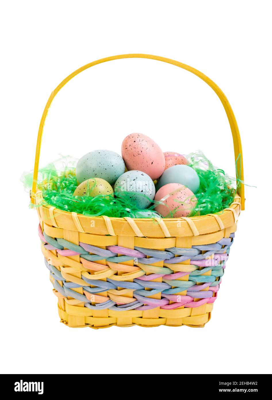 Easter eggs in a yellow wicker basket. Stock Photo
