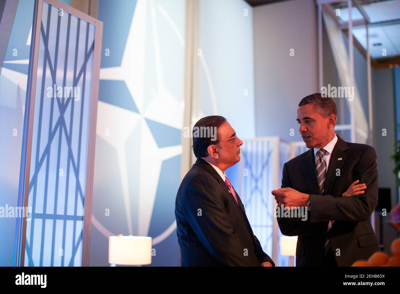 President Barack Obama talks with President Asif Ali Zardari of Pakistan before a meeting on Afghanistan with heads of state and government during the NATO Summit in Chicago, Ill., May 21, 2012. Stock Photo
