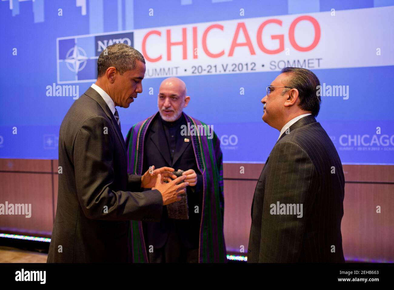 President Barack Obama speaks with President Hamid Karzai of Afghanistan, center, and President Asif Ali Zardari of Pakistan at the McCormick Place Convention Center during the NATO Summit in Chicago, Illinois, May 21, 2012. Stock Photo
