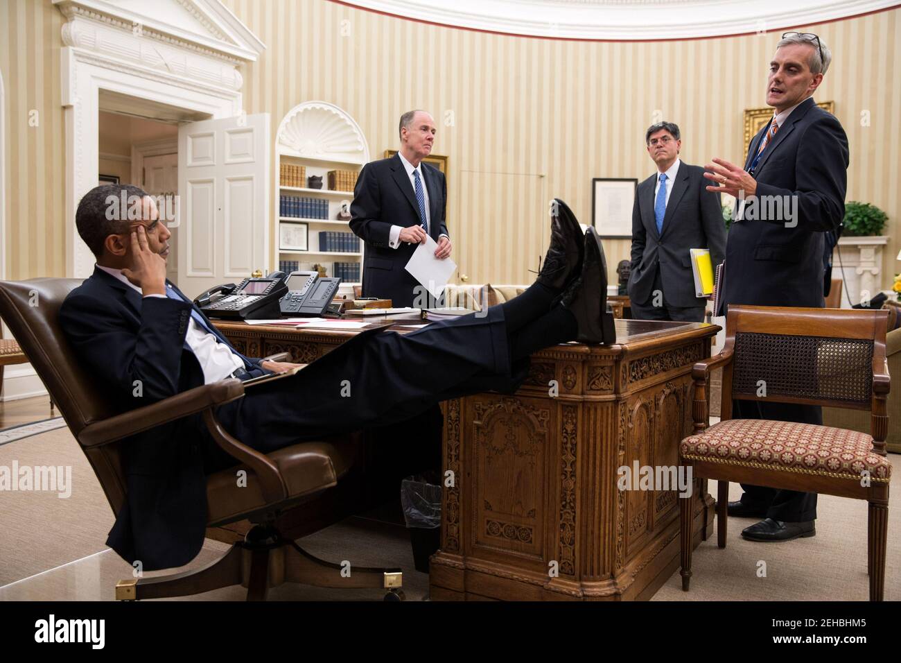 President Barack Obama meets with National Security Advisor Tom Donilon, Chief of Staff Jack Lew, and Deputy National Security Advisor Denis McDonough in the Oval Office, Nov. 14, 2012. Stock Photo