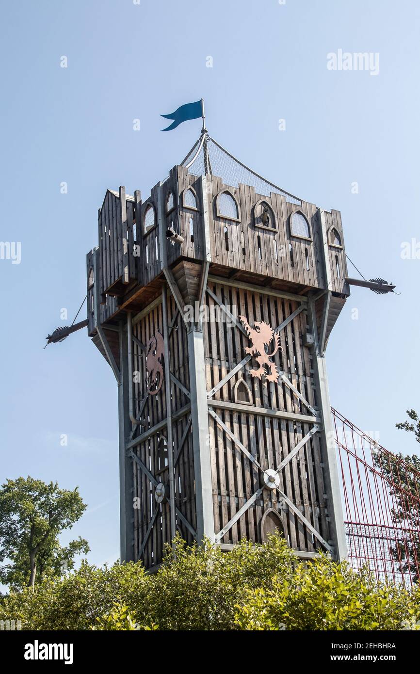 8-28-2019 Tall wooden play climbing castle with flag and climbing bridge a Gathering Place public park in Oklahoma Stock Photo