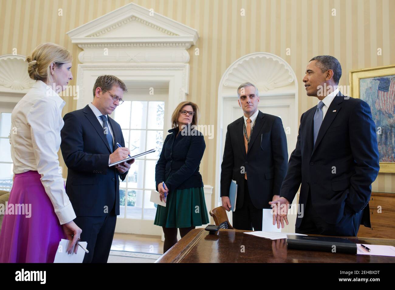 President Barack Obama talks with senior advisors in the Oval Office ...