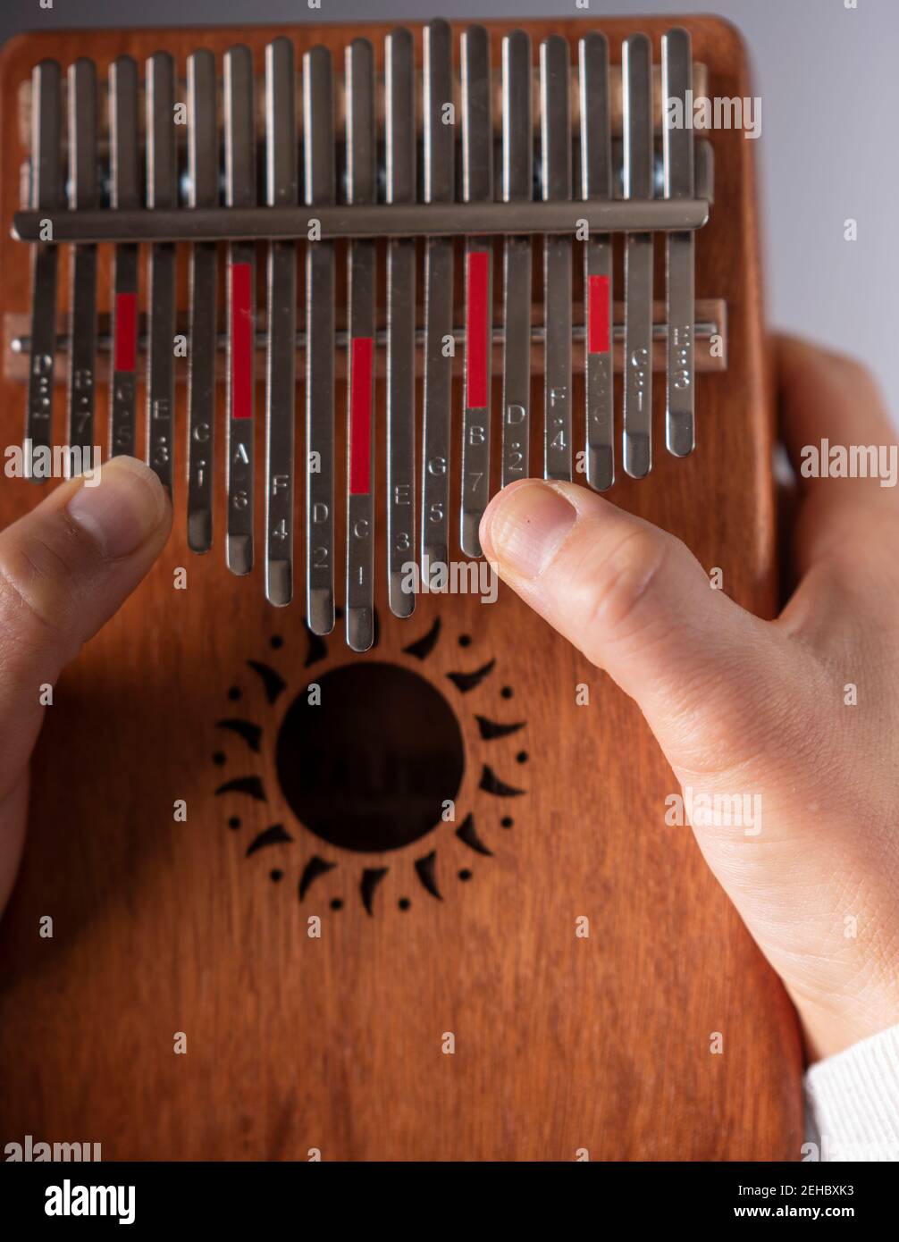 woman's hands playing the kalimba Stock Photo Alamy