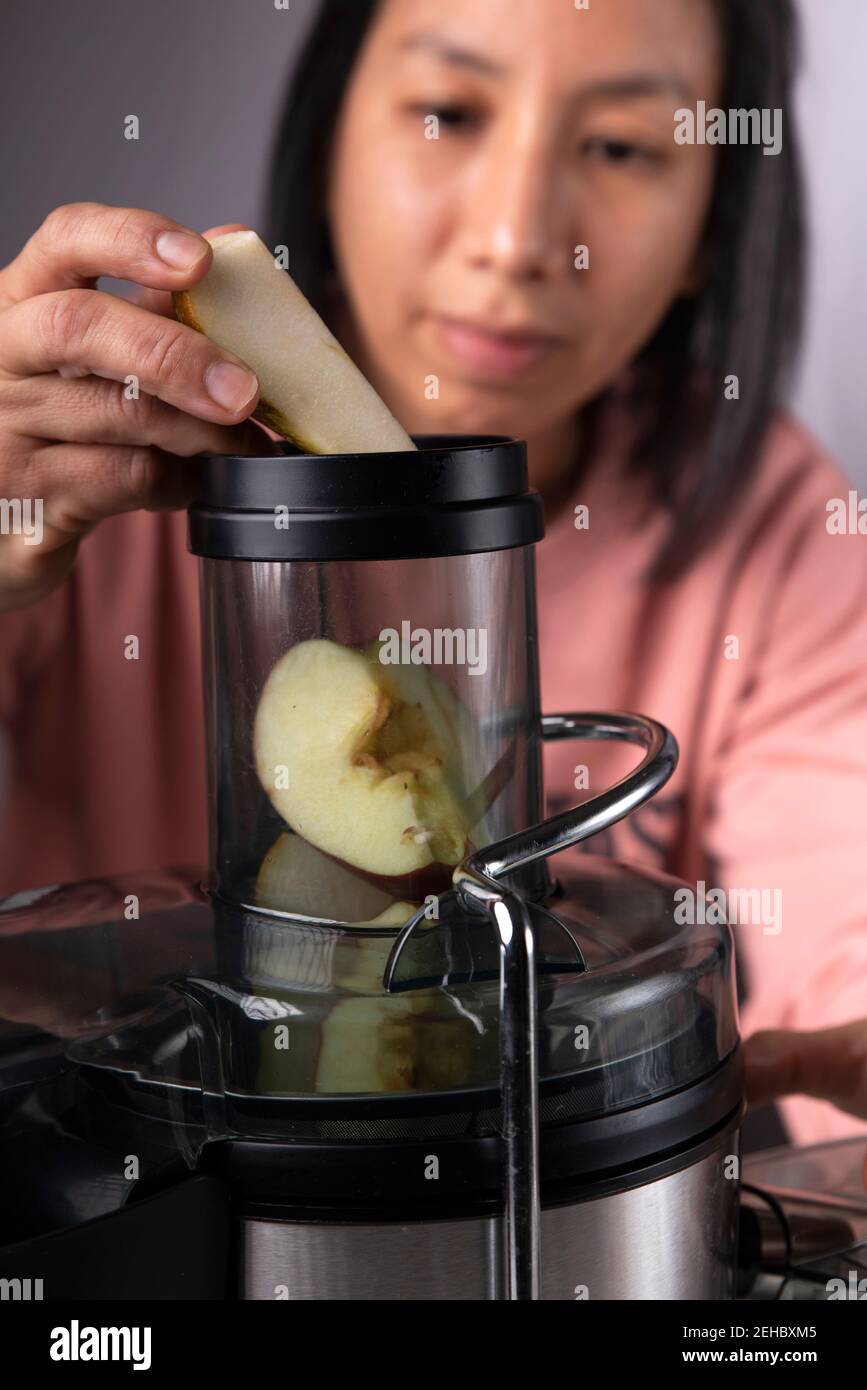 woman preparing a fruit juice Stock Photo Alamy