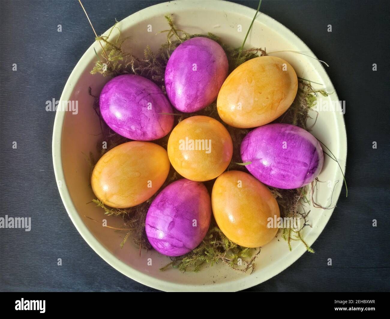 Easter decoration with colored eggs against a black background Stock Photo