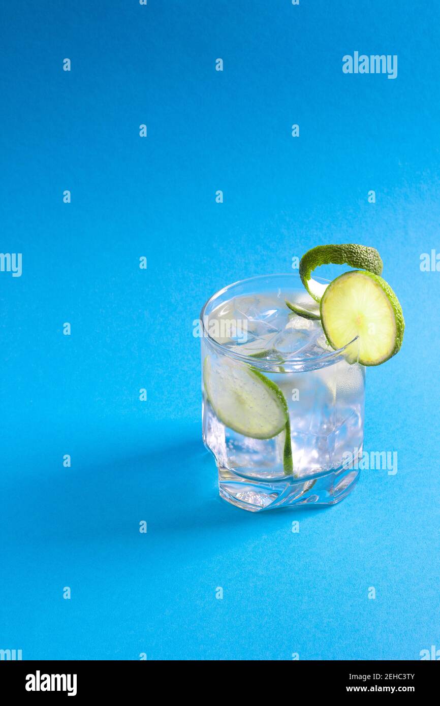 Ice cold drink with lime slices attached Stock Photo