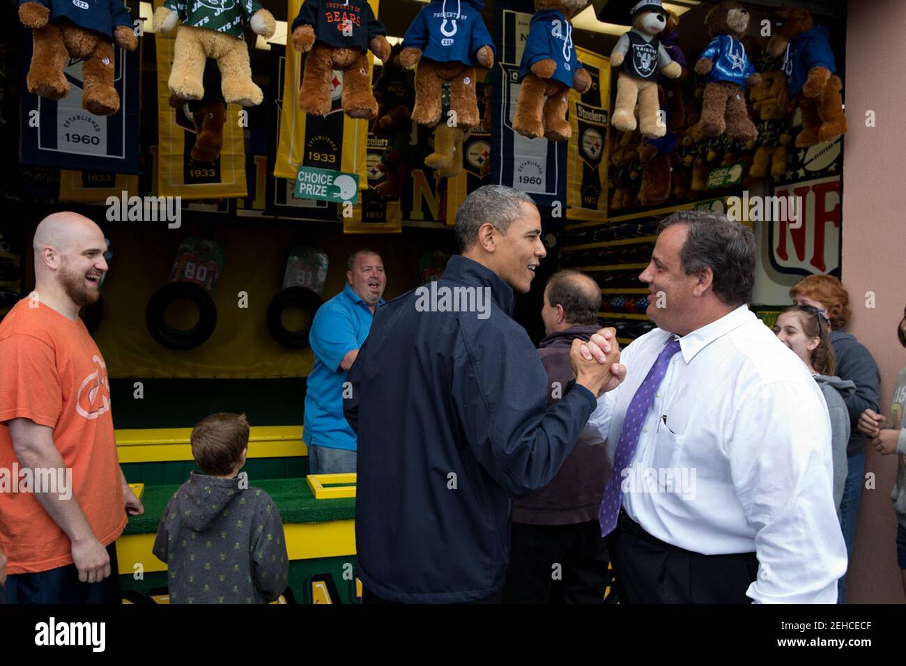 May 28, 2013 'The President congratulates New Jersey Gov. Chris Christie while playing the 'TouchDown Fever' arcade game along the Point Pleasant boardwalk in Point Pleasant Beach, N.J. The President toured the boardwalk which had reopened following the devastation of Hurricane Sandy in 2012.' Stock Photo