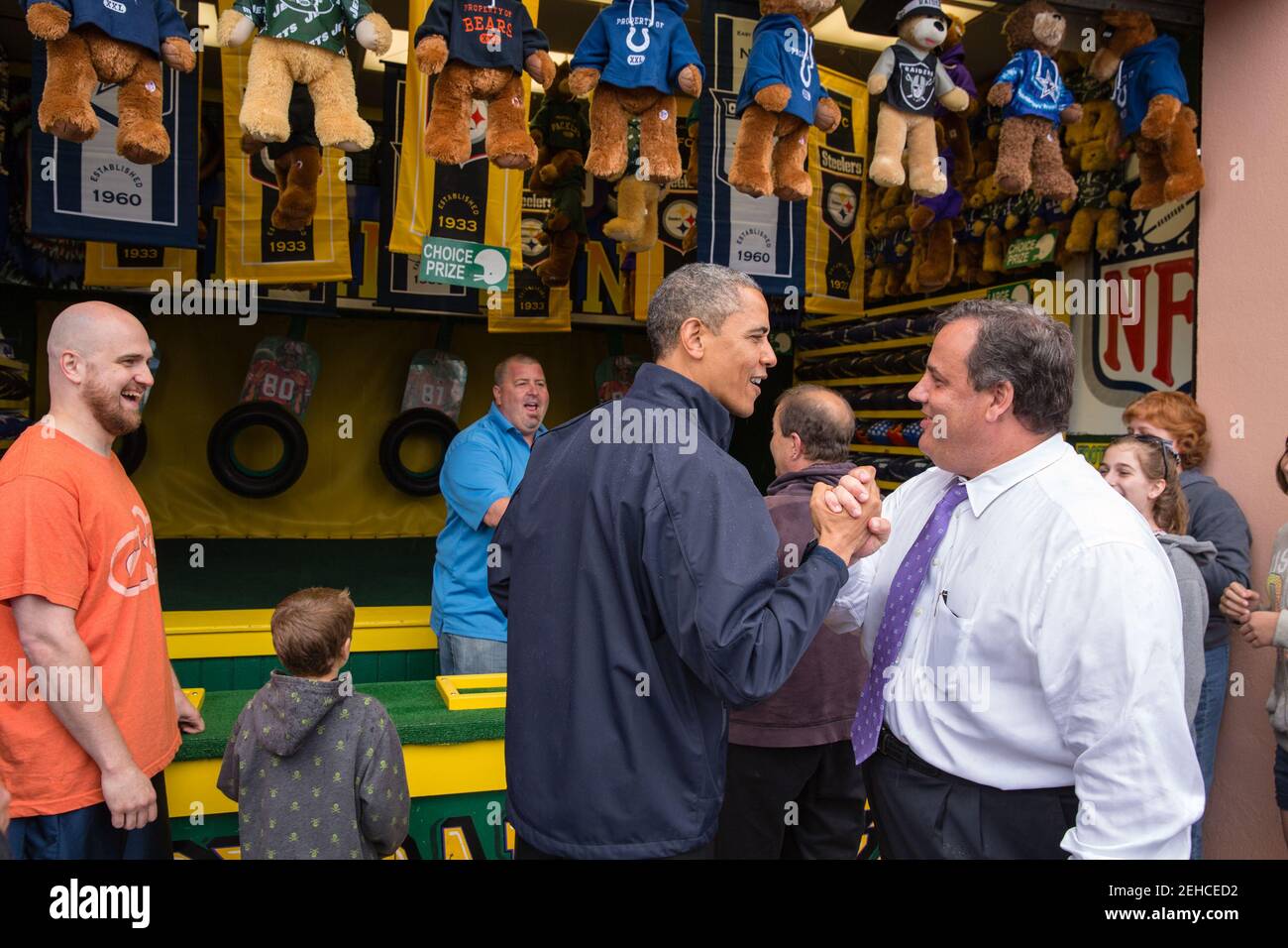 President Barack Obama congratulates New Jersey Governor Chris Christie while playing the 'TouchDown Fever' arcade game along the Point Pleasant boardwalk in Point Pleasant Beach, N.J., May 28, 2013. Stock Photo