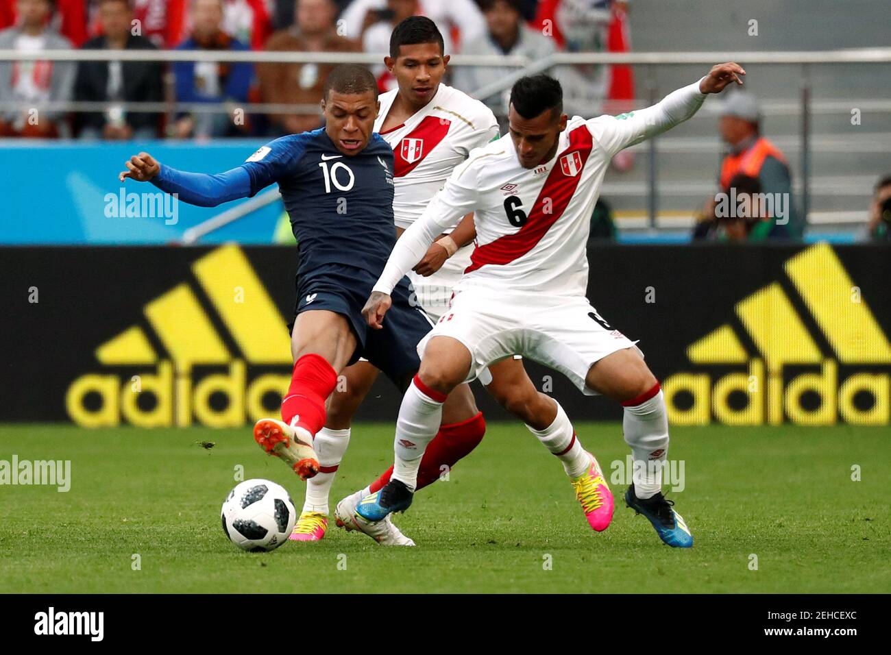 Soccer Football - World Cup - Group C - France vs Peru - Ekaterinburg Arena, Yekaterinburg, Russia - June 21, 2018   France's Kylian Mbappe in action with Peru's Miguel Trauco and Edison Flores     REUTERS/Damir Sagolj Stock Photo