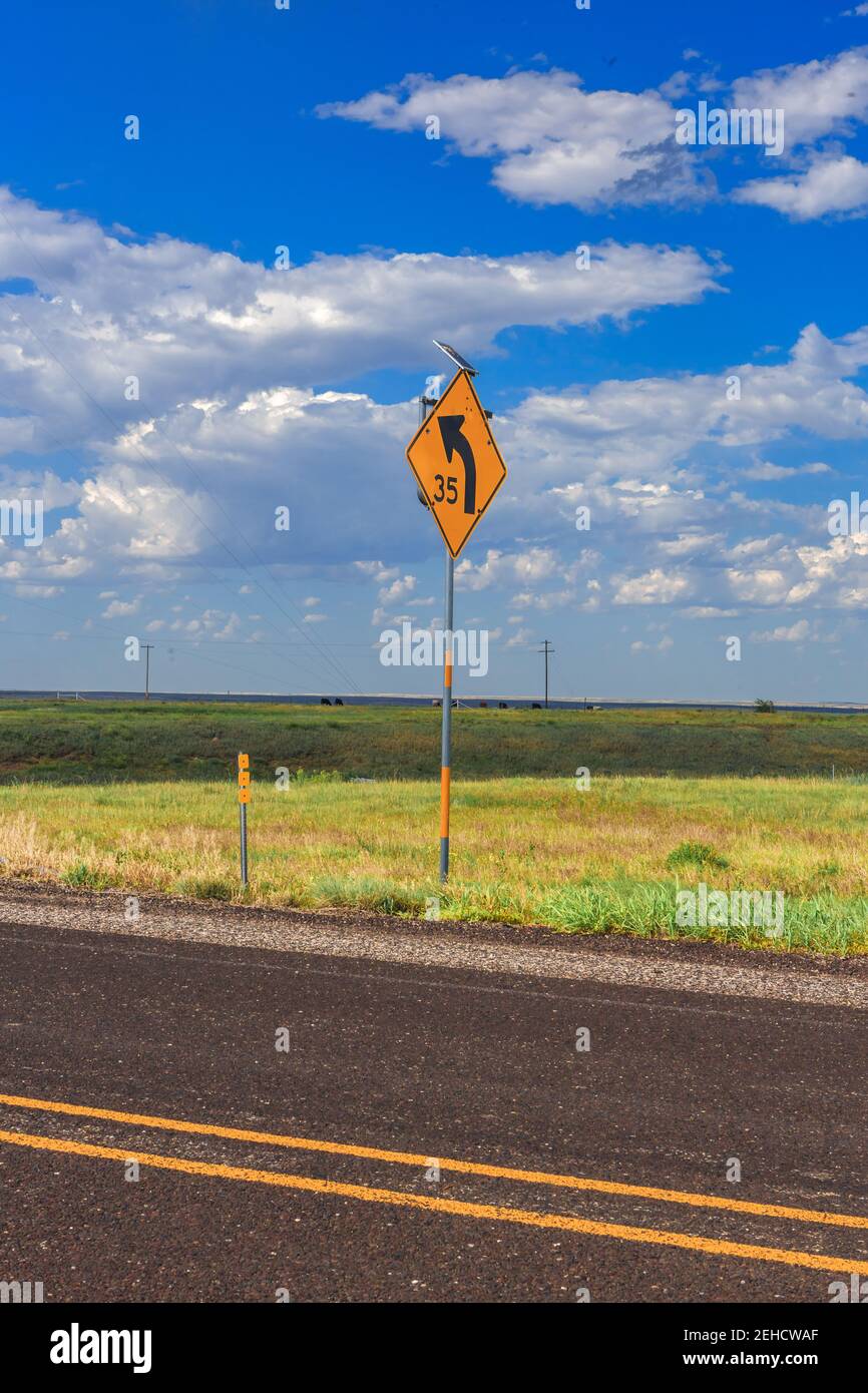 Left hand curve sign, Route 70 off of Route 40 Texas Stock Photo