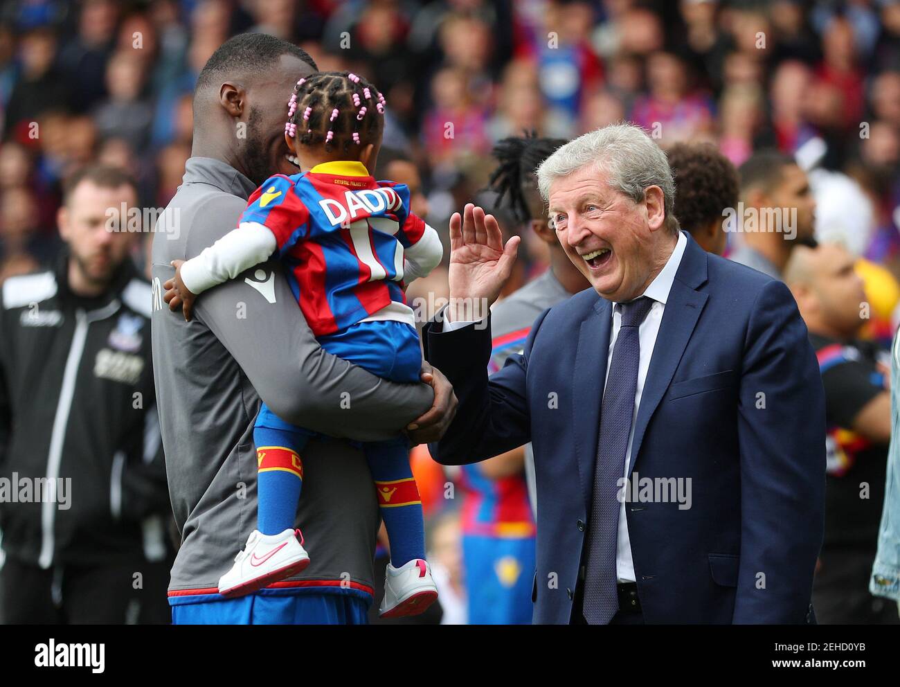 Soccer Football - Premier League - Crystal Palace vs West Bromwich Albion - Selhurst Park, London, Britain - May 13, 2018   Crystal Palace's Christian Benteke and child with Crystal Palace manager Roy Hodgson after the match   REUTERS/Hannah McKay    EDITORIAL USE ONLY. No use with unauthorized audio, video, data, fixture lists, club/league logos or 'live' services. Online in-match use limited to 75 images, no video emulation. No use in betting, games or single club/league/player publications.  Please contact your account representative for further details. Stock Photo