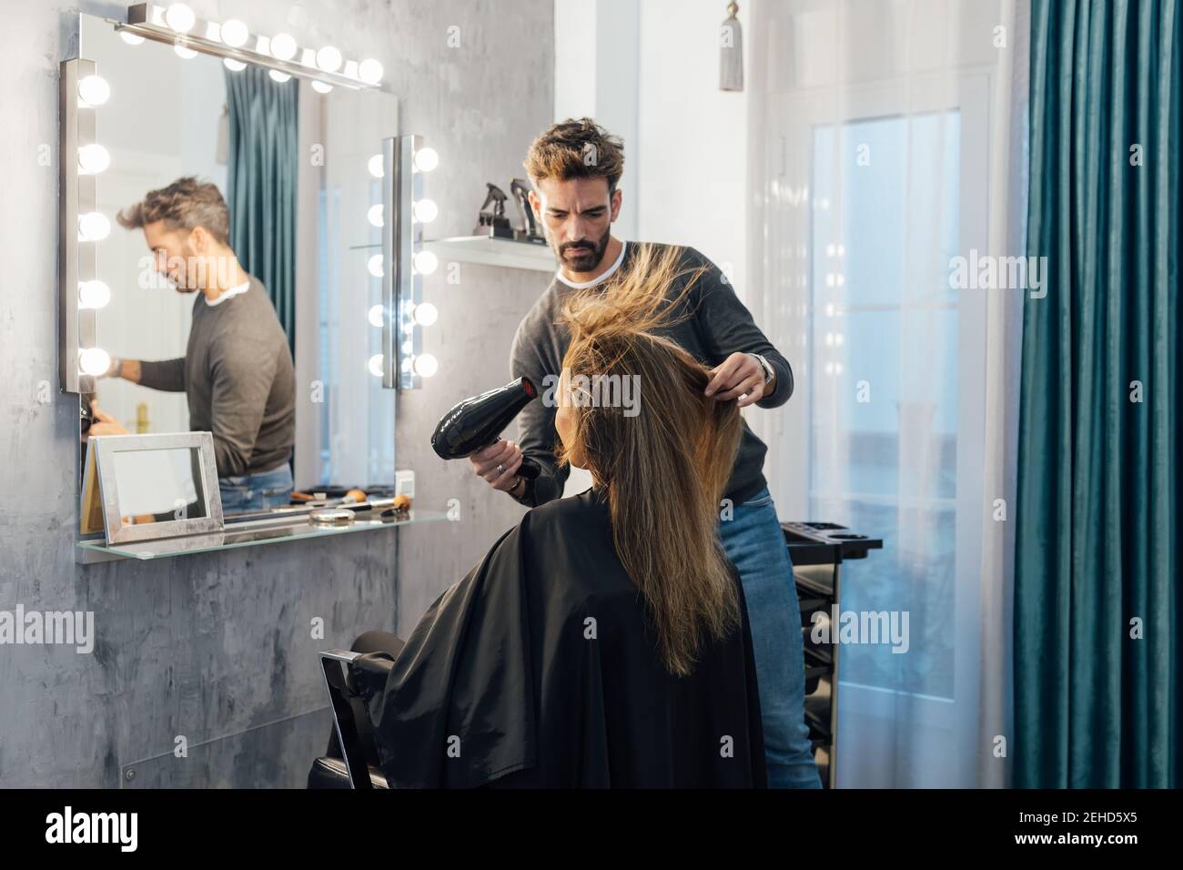 Professional stylist drying hair male hi-res stock photography and ...