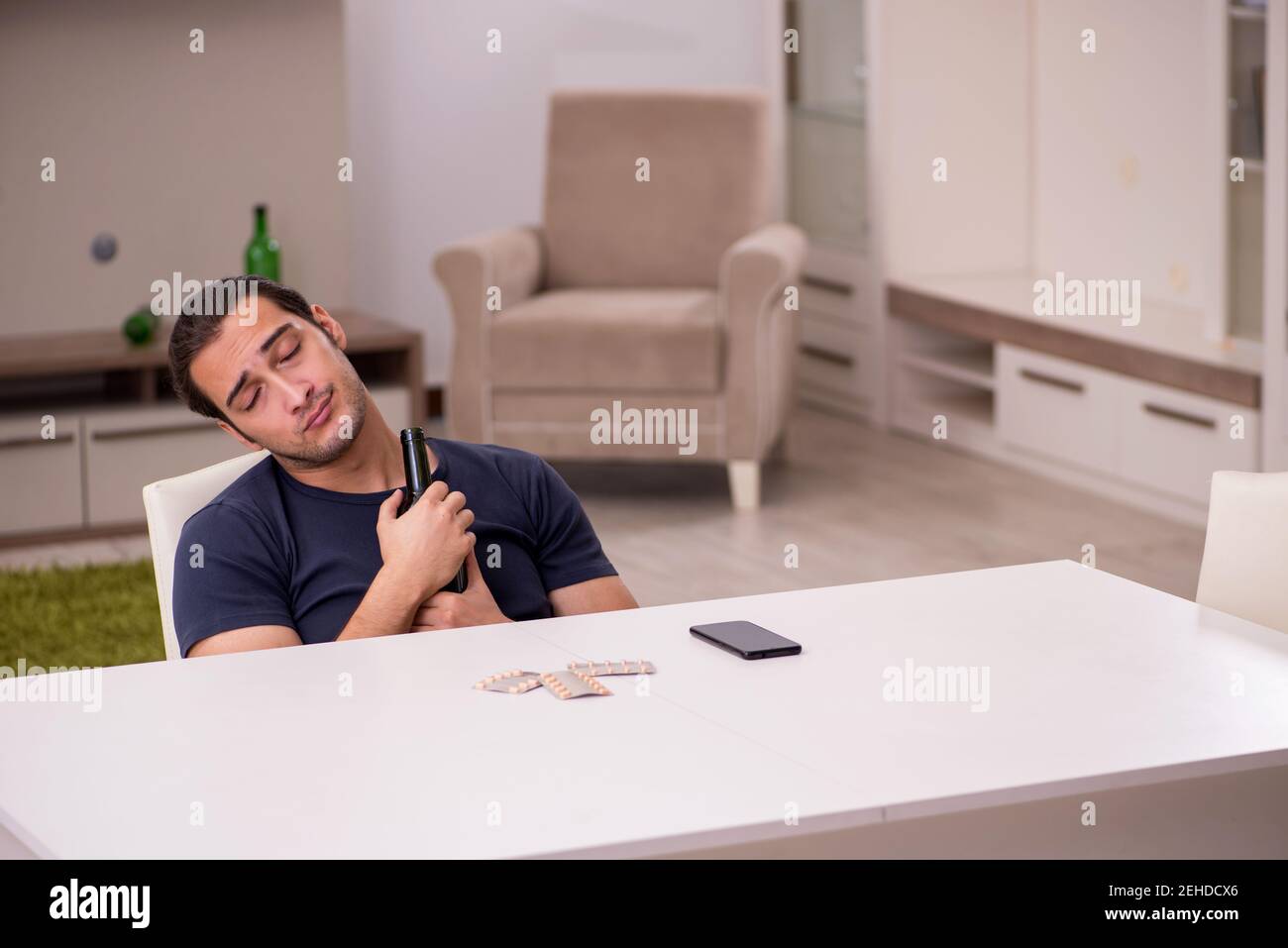 Young sick alcoholic suffering at home Stock Photo Alamy