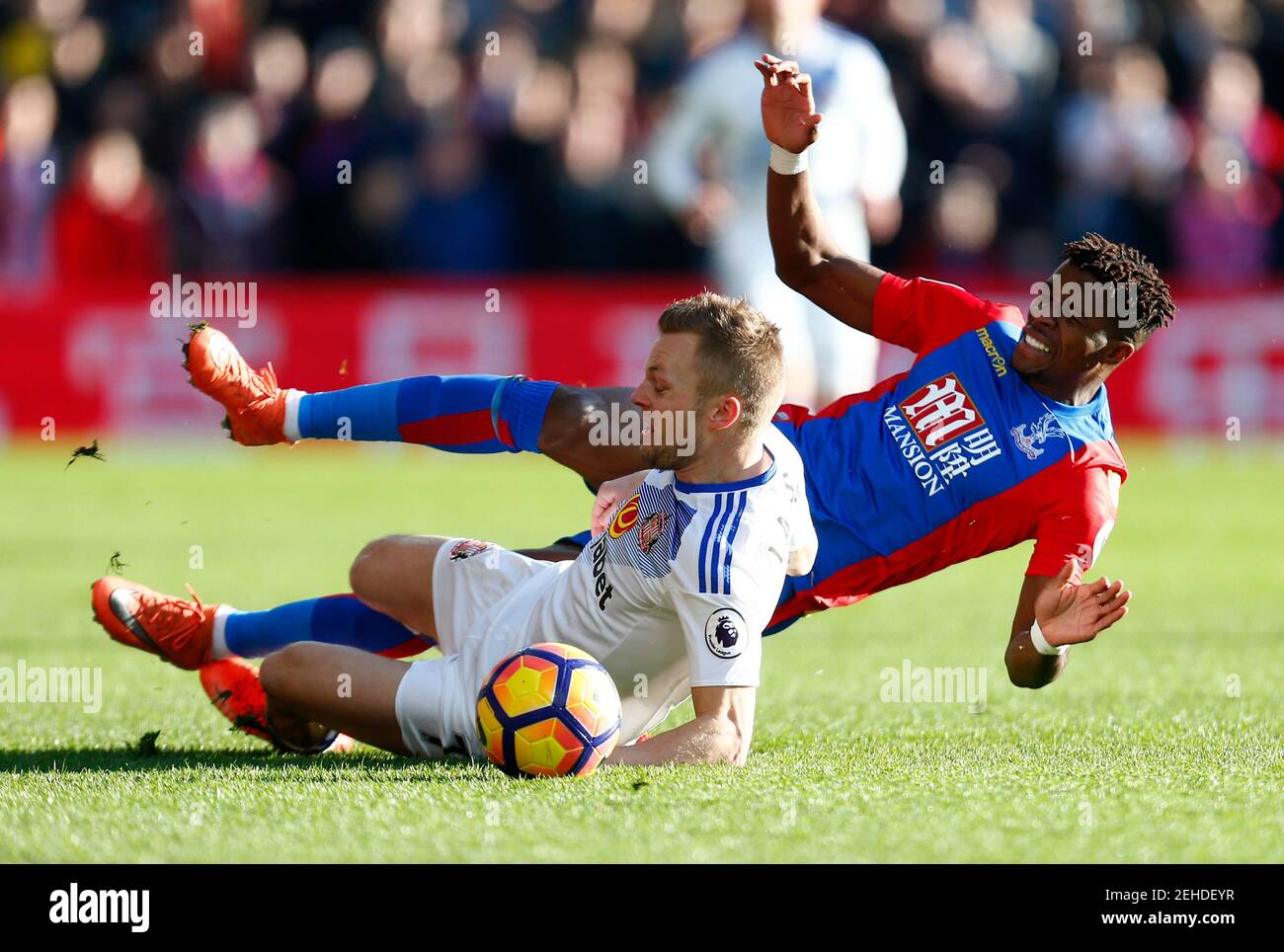 Britain Football Soccer - Crystal Palace v Sunderland - Premier League - Selhurst Park - 4/2/17 Sunderland's Sebastian Larsson fouls Crystal Palace's Wilfried Zaha to earn a booking Reuters / Andrew Winning Livepic EDITORIAL USE ONLY. No use with unauthorized audio, video, data, fixture lists, club/league logos or 'live' services. Online in-match use limited to 45 images, no video emulation. No use in betting, games or single club/league/player publications.  Please contact your account representative for further details. Stock Photo