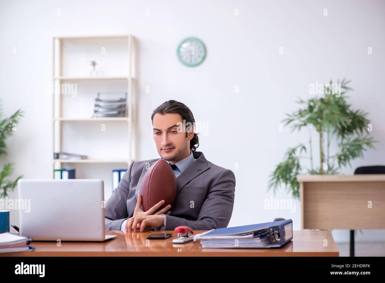 Man in suit playing rugby hi-res stock photography and images - Alamy