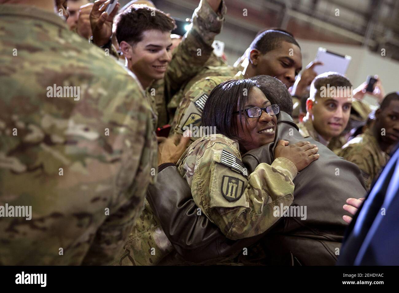 A soldier hugs President Barack Obama following his remarks at Bagram Airfield, Afghanistan, Sunday, May 25, 2014. Stock Photo