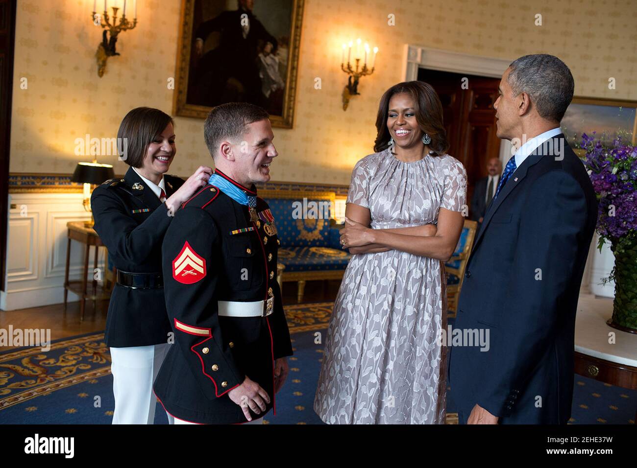 President Barack Obama and First Lady Michelle Obama talk with Corporal William 'Kyle' Carpenter, U.S. Marine Corps (Ret.) in the Blue Room following a Medal of Honor ceremony in the East Room of the White House, June 19, 2014. Cpl. Carpenter received the Medal of Honor for his courageous actions while serving as an Automatic Rifleman with Company F, 2d Battalion, 9th Marines, Regimental Combat Team 1, 1st Marine Division (Forward), I  Marine Expeditionary Force (Forward), in Helmand Province, Afghanistan. Stock Photo