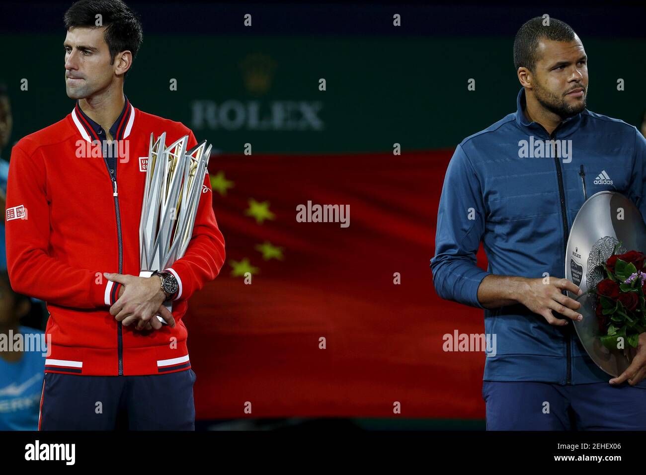 The winner Novak Djokovic of Serbia (L) and Jo-Wilfried Tsonga of France hold trophies after their men's singles final match at the Shanghai Masters tennis tournament in Shanghai, China, October 18, 2015.  REUTERS/Damir Sagolj   Picture Supplied by Action Images Stock Photo