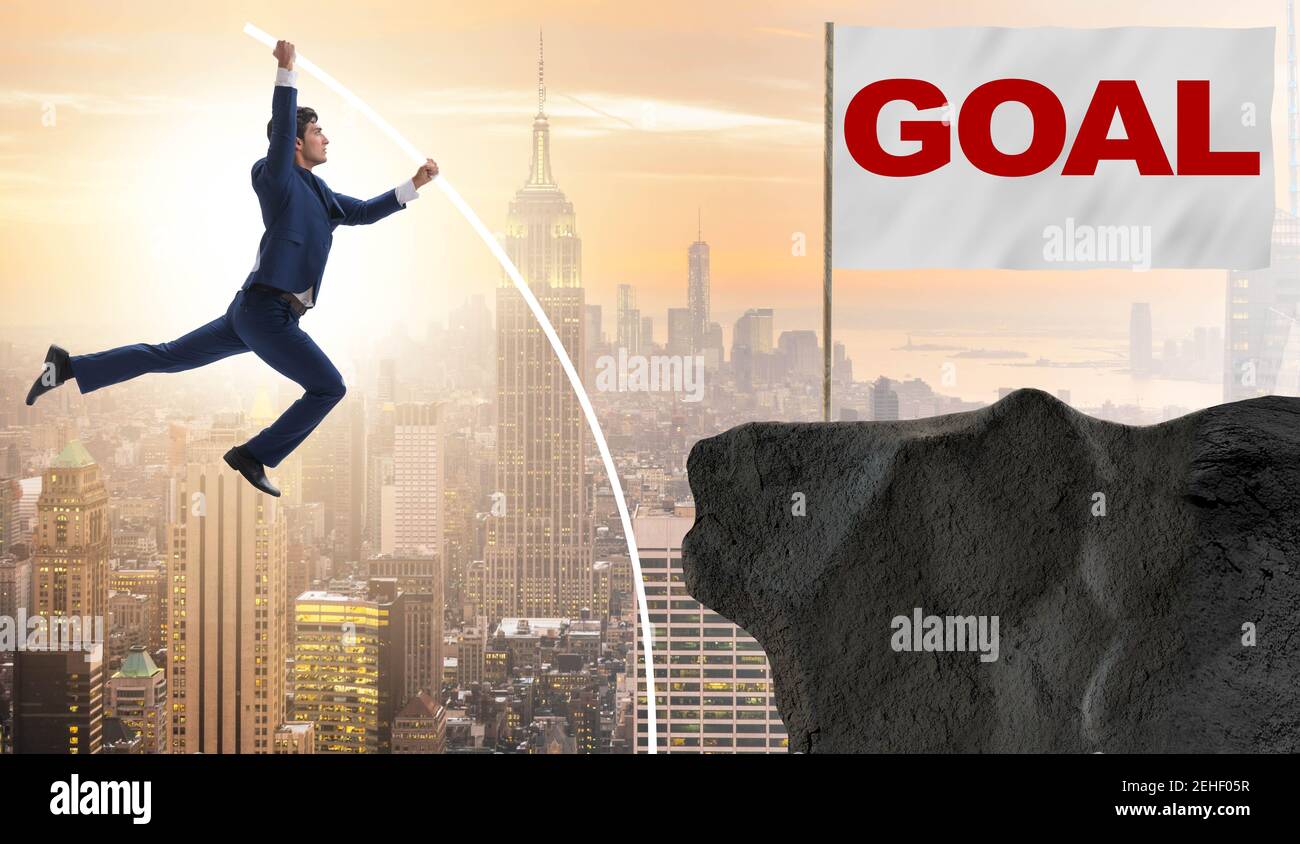 The businessman pole vaulting towards his success goal Stock Photo - Alamy