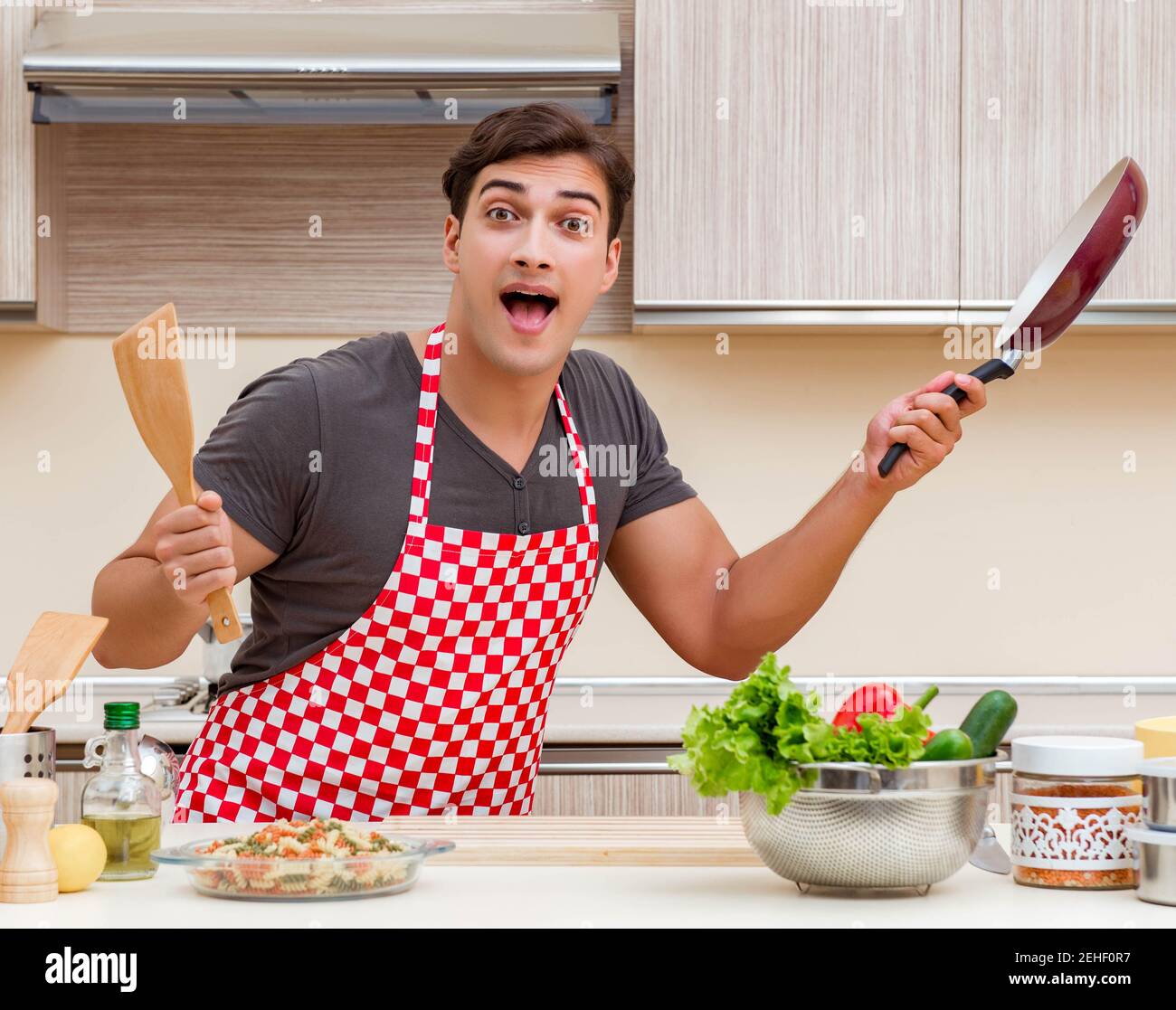 The man male cook preparing food in kitchen Stock Photo - Alamy