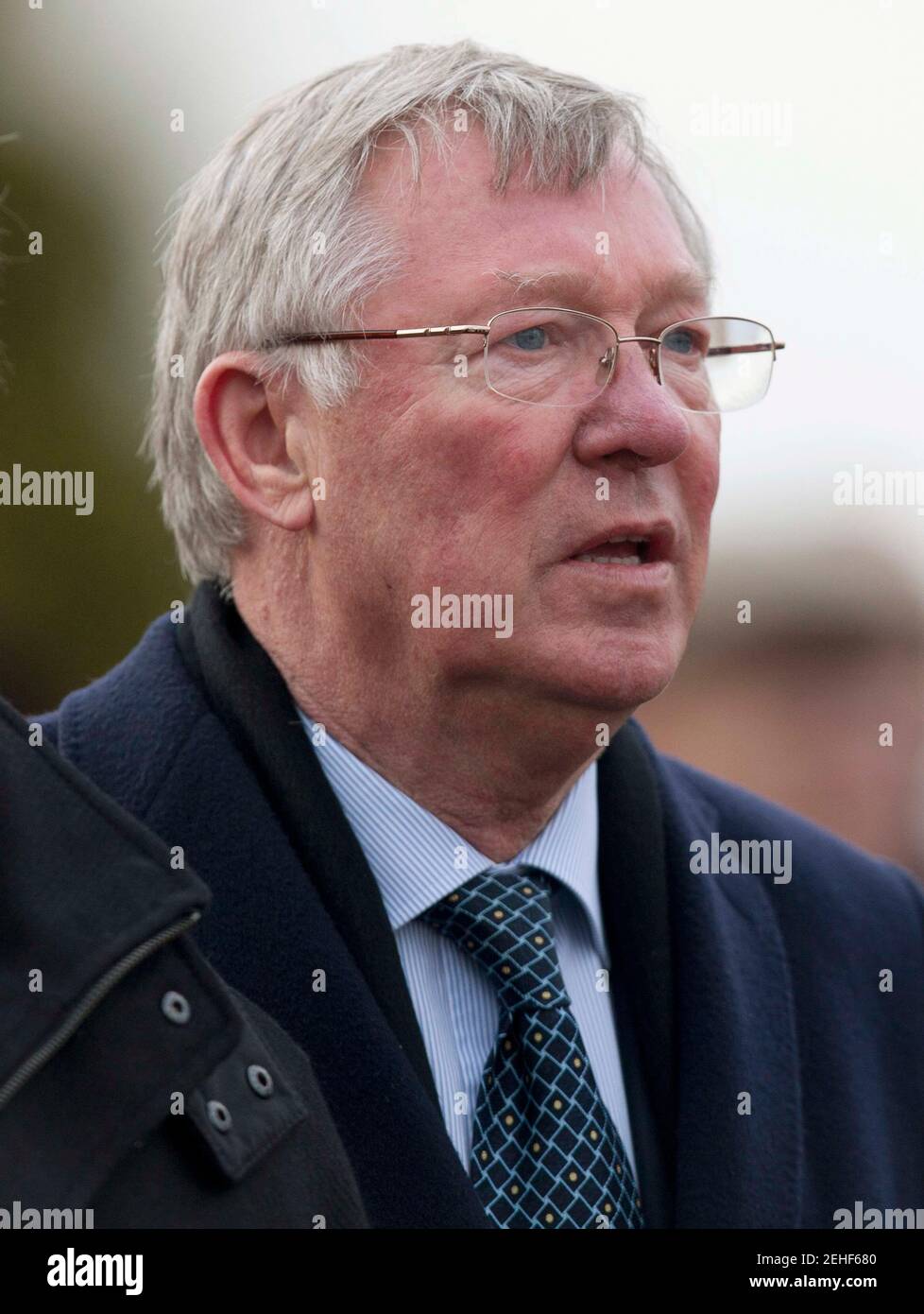Horse Racing - Cheltenham Festival  - Cheltenham Racecourse - 14/3/13  Manchester United manager Sir Alex Ferguson watches his horse Harry The Viking run in the 16.40 Fulke Walwyn Kim Muir Challenge Cup Handicap Steeple Chase  Mandatory Credit: Action Images / Julian Herbert  Livepic *** Local Caption *** - Stock Photo