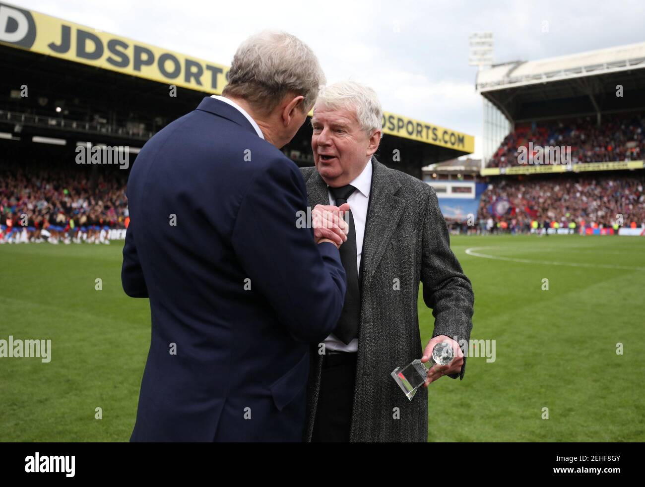 Soccer Football - Premier League - Crystal Palace vs West Bromwich Albion - Selhurst Park, London, Britain - May 13, 2018   Crystal Palace manager Roy Hodgson presents an award to commentator John Motson after the match   REUTERS/Hannah McKay    EDITORIAL USE ONLY. No use with unauthorized audio, video, data, fixture lists, club/league logos or "live" services. Online in-match use limited to 75 images, no video emulation. No use in betting, games or single club/league/player publications.  Please contact your account representative for further details. Stock Photo