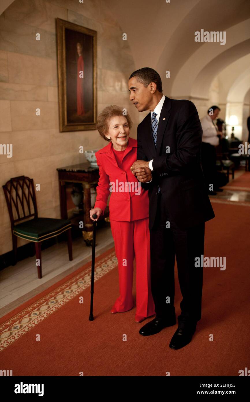 President Barack Obama and former First Lady Nancy Reagan walk side-by ...