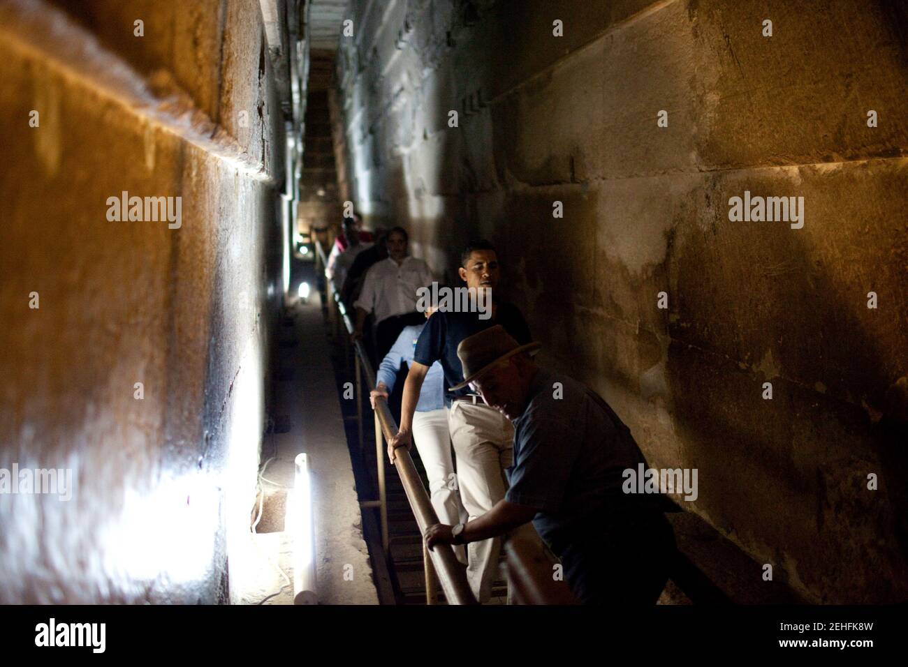 President Barack Obama carefully descends a steep flight of steps on a tour of the Pyramids of Giza with Senior Staff in Egypt on June 4, 2009. Stock Photo