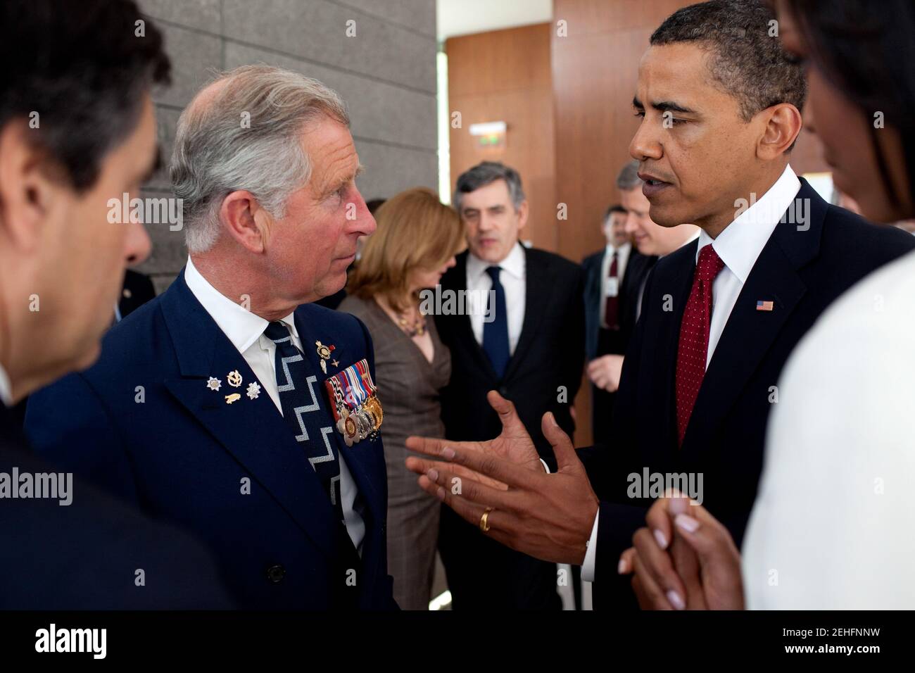 President Barack Obama speaks with Prince Charles following the President's speech at the memorial service at the Normandy American Cemetery in Colleville-sur-Mer, France, on the 65th anniversary of the D-Day landings, June 6, 2009. Stock Photo