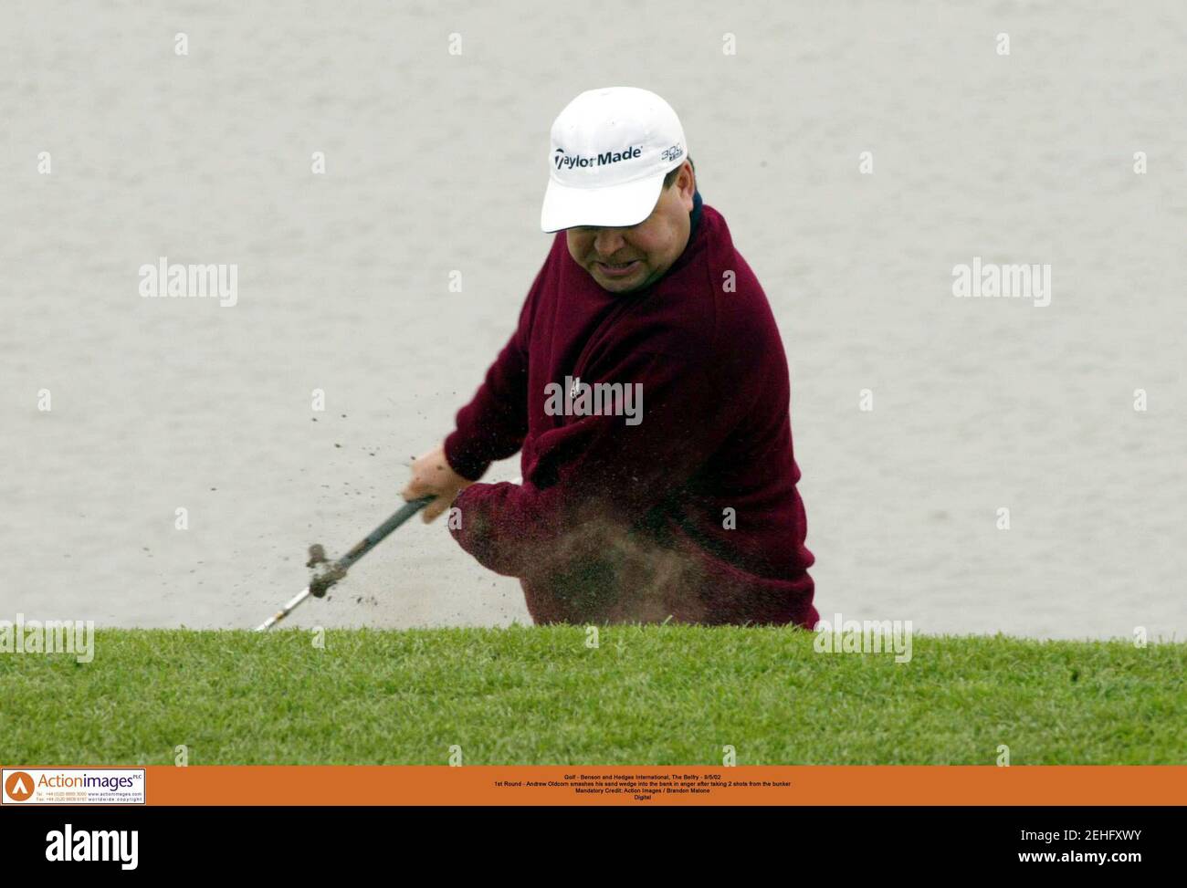 Golf - Benson and Hedges International, The Belfry - 9/5/02  1st Round - Andrew Oldcorn smashes his sand wedge into the bank in anger after taking 2 shots from the bunker  Mandatory Credit: Action Images / Brandon Malone  Digital Stock Photo