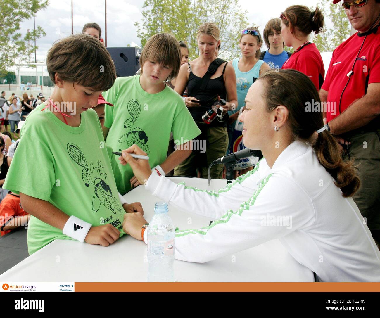 Tennis - Sony Ericsson WTA - Autograph Signing Session - Montreal, Canada - 16/8/06  Martina Hingis of Switzerland signs a shirt at the Rogers Cup, Sony Ericsson WTA Tour  Mandatory Credit: Action Images / Chris Wattie  Livepic Stock Photo