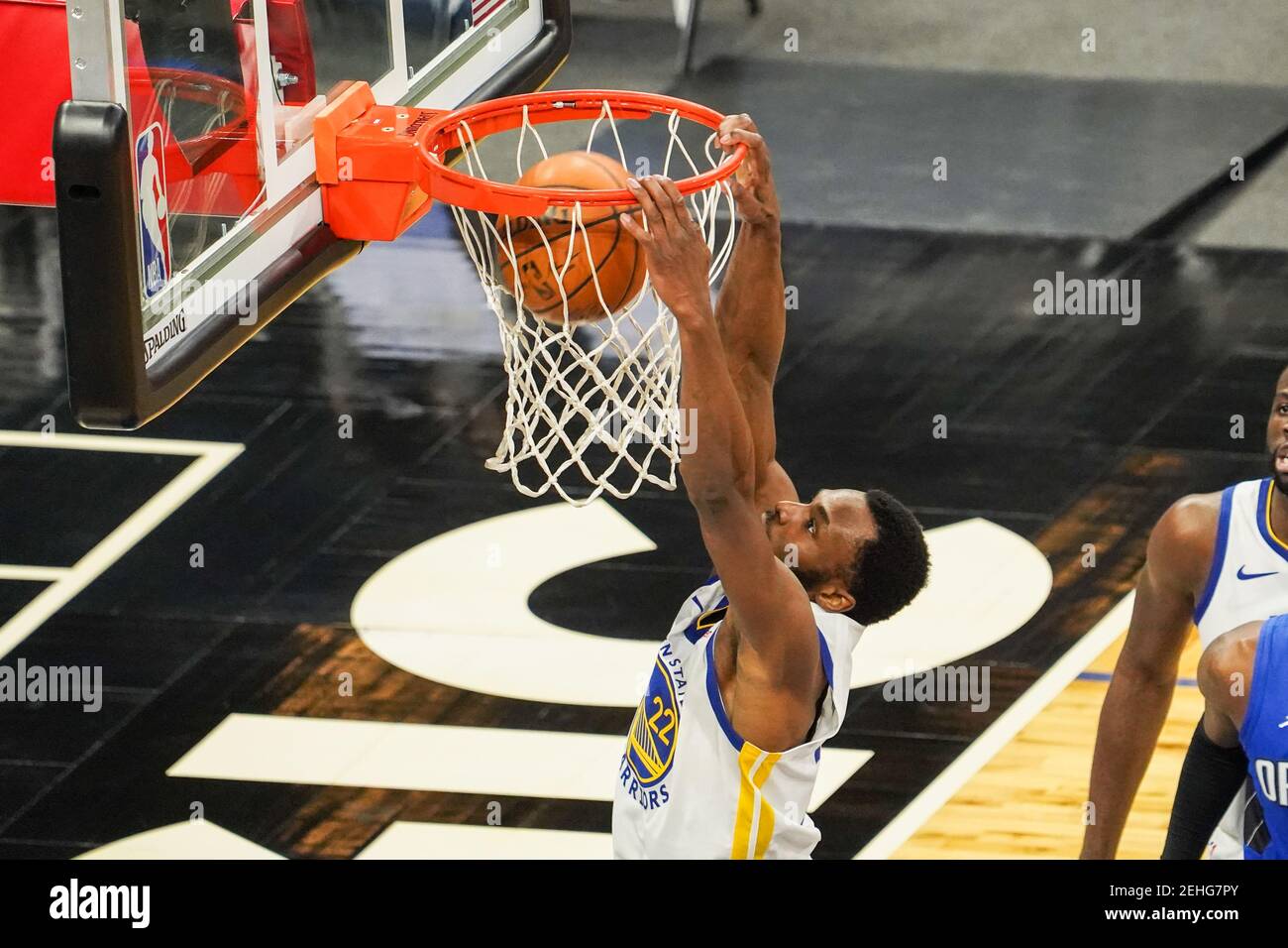 Orlando, Florida, USA, February 19, 2021, Golden State Warriors player Andrew Wiggins #22 makes a dunk against the Orlando Magic at the Amway Center  (Photo Credit:  Marty Jean-Louis) Credit: Marty Jean-Louis/Alamy Live News Stock Photo