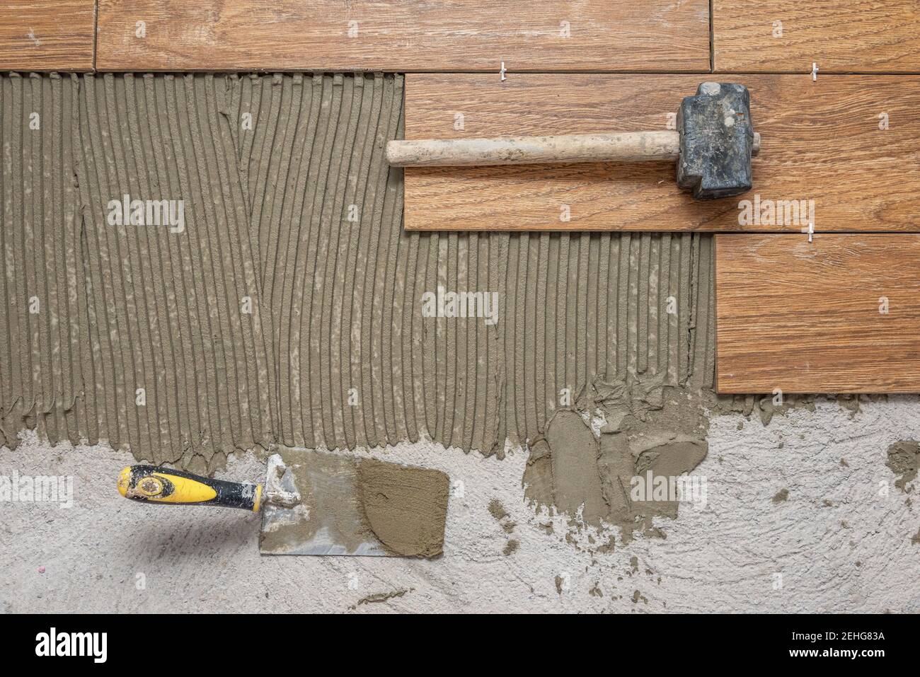 Ceramic tiles and tools for tiler. Floor tiles installation. Home