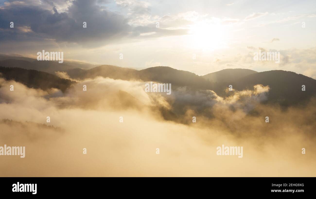Beautiful sunset sky above clouds Stock Photo - Alamy