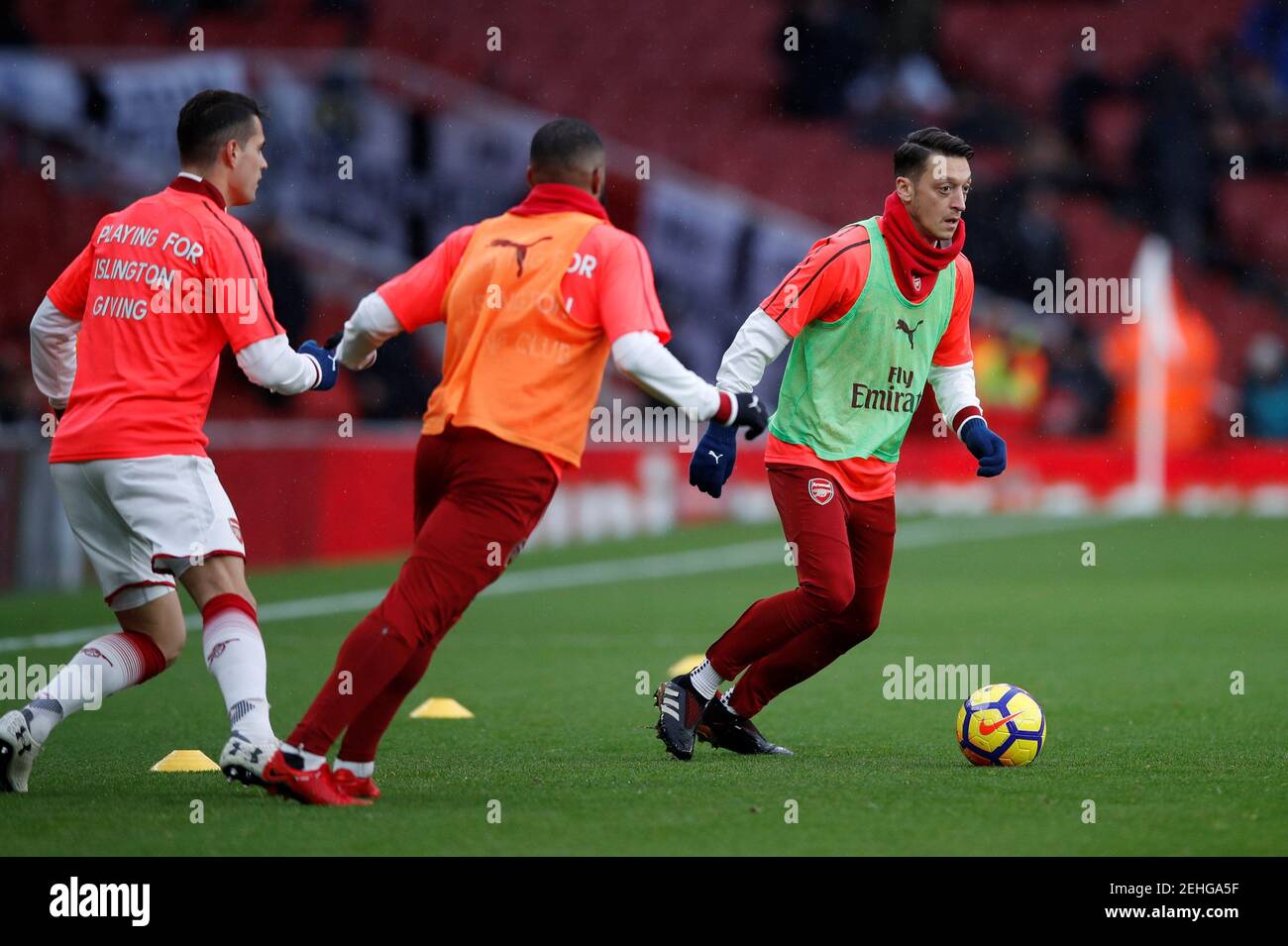 Soccer Football - Premier League - Arsenal vs Newcastle United - Emirates Stadium, London, Britain - December 16, 2017 Arsenal's Mesut Ozil warms up before the match REUTERS/Eddie Keogh EDITORIAL USE ONLY. No use with unauthorized audio, video, data, fixture lists, club/league logos or "live" services. Online in-match use limited to 75 images, no video emulation. No use in betting, games or single club/league/player publications. Please contact your account representative for further details. Stock Photo