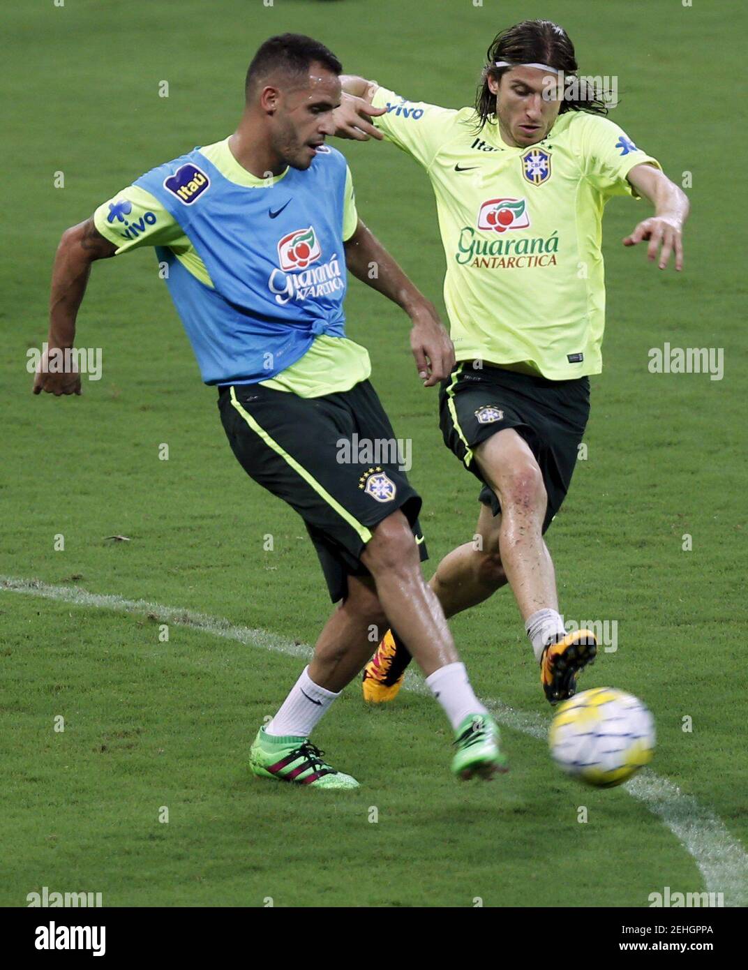 Football Soccer - Brazil training session - World Cup 2018 qualifier - Recife, Brazil- 24/3/16 Filipe Luis (R) in action with Renato Augusto during a training session during a training session ahead of World Cup 2018 qualifier match against Uruguay. REUTERS/Paulo Whitaker   Picture Supplied by Action Images Stock Photo