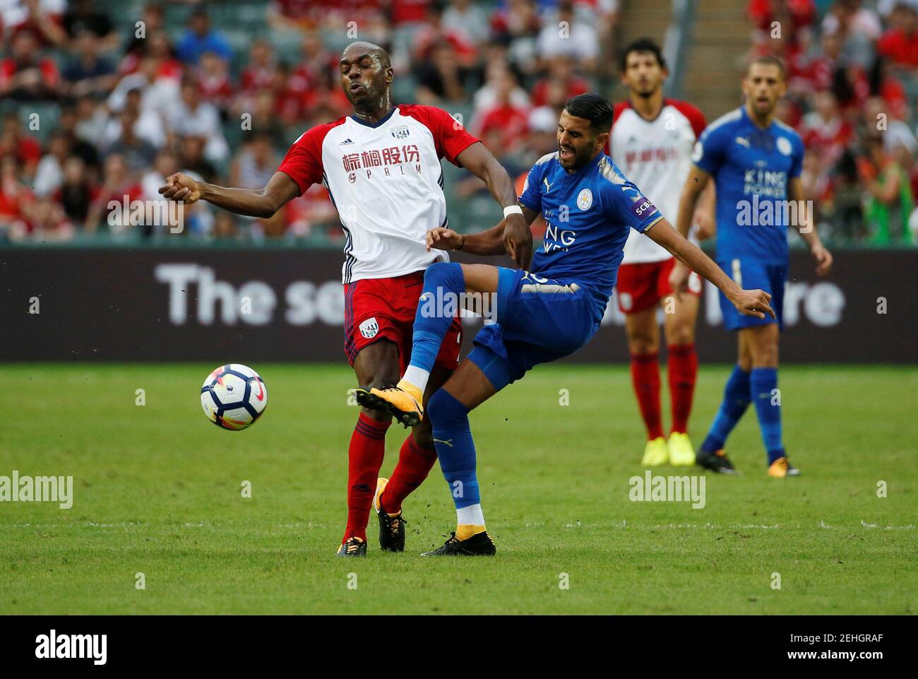 Soccer Football - Leicester City vs West Bromwich Albion - Premier League Asia Trophy - Hong Kong, China - July 19, 2017   Leicester's Riyad Mahrez in action with West Brom's Allan Nyom   REUTERS/Bobby Yip Stock Photo
