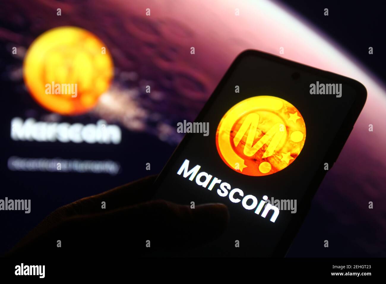 In this photo illustration a Marscoin cryptocurrency logo is seen on a