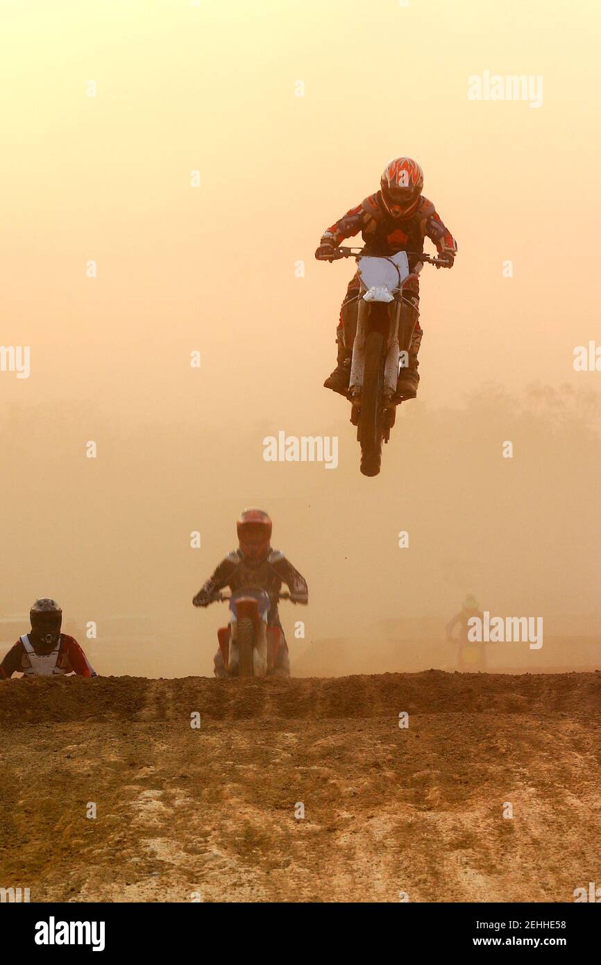 Motocross bike Jump in the sunset Stock Photo - Alamy