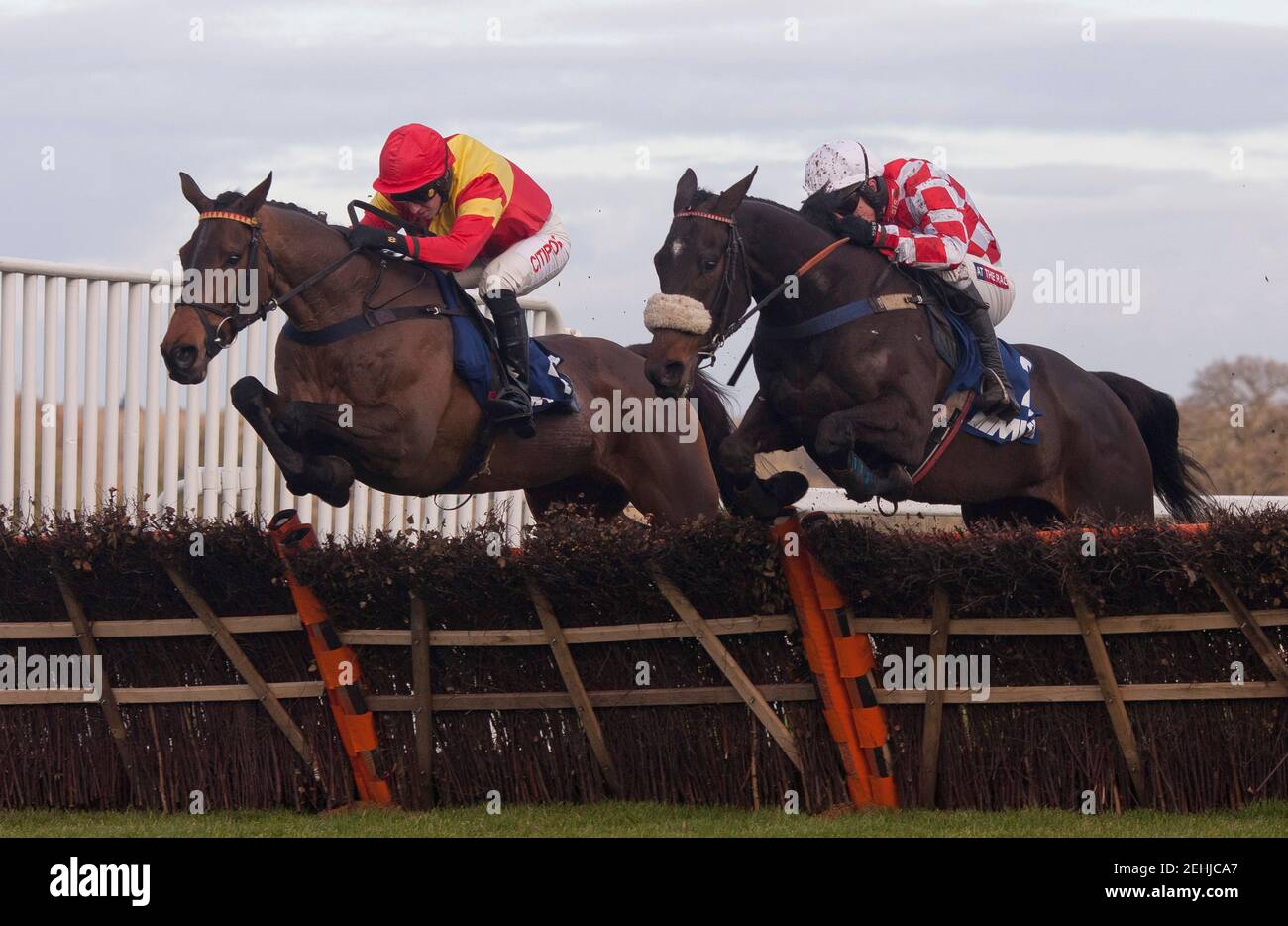 Horse Racing - Ascot - Ascot Racecourse - 21/12/12  Puffin Billy ridden by Barry Geraghty (R) pulls away from the last flight with Up To Something ridden by Noel Fehily before going on to win the 13.55, The Mitie Kennel Gate Novices' Hurdle  Mandatory Credit: Action Images / Julian Herbert  Livepic Stock Photo