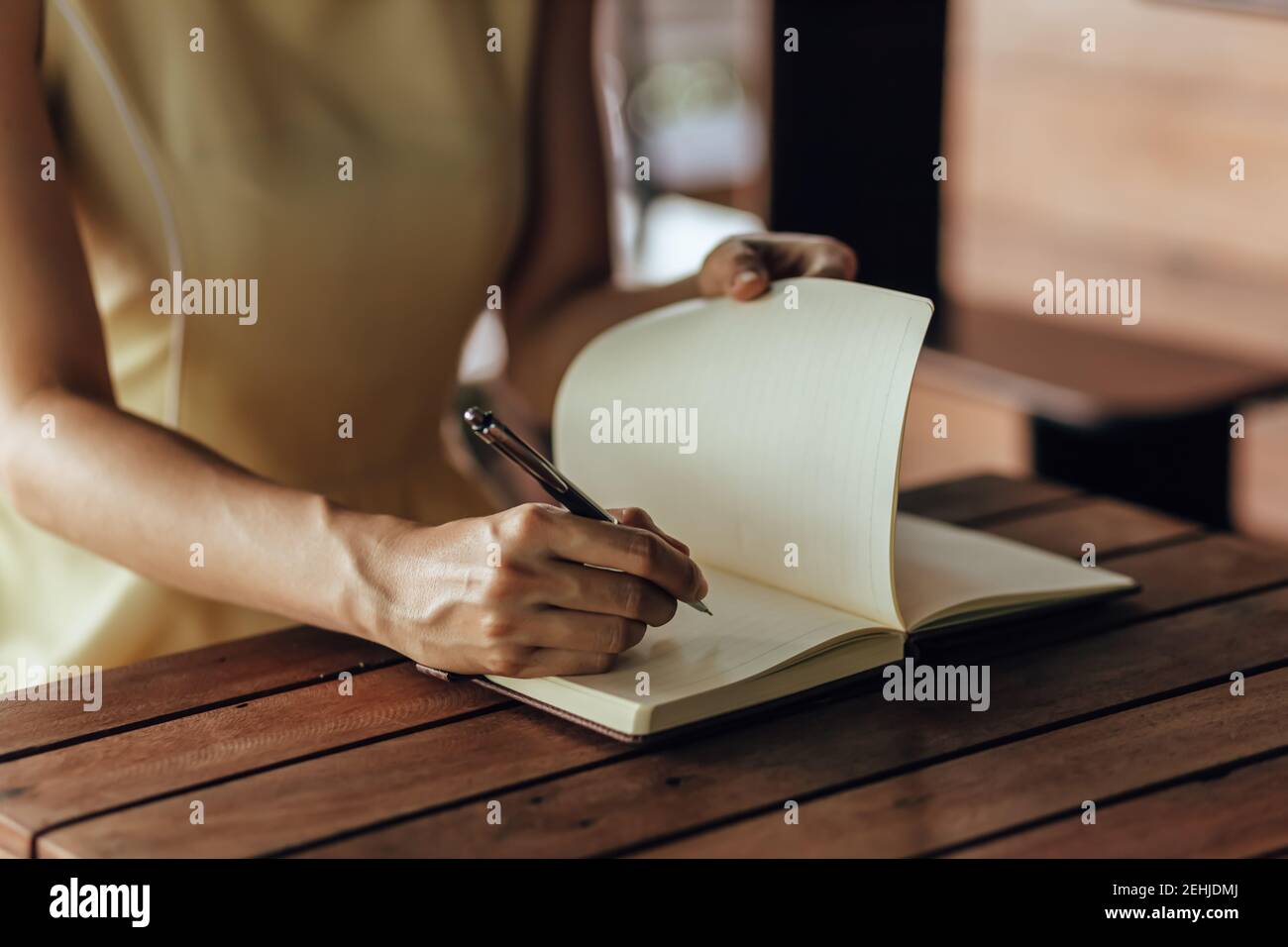 Woman Writing Woman writing notes table hi-res stock photography and images - Alamy