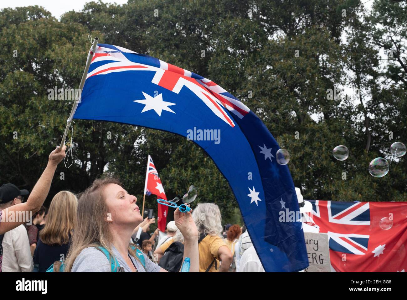 Melbourne, Australia. 20th Feb 2021. Anti-vaccination protesters gather in Fawkner Park to condemn the coronavirus jab in the name of medical freedom. Organisers stated that ‘millions’ will be marching Australia-wide at eleven different locations, although that number may be massively exaggerated. February 20, 2021. Melbourne, Australia. Credit: Jay Kogler/Alamy Live News Stock Photo