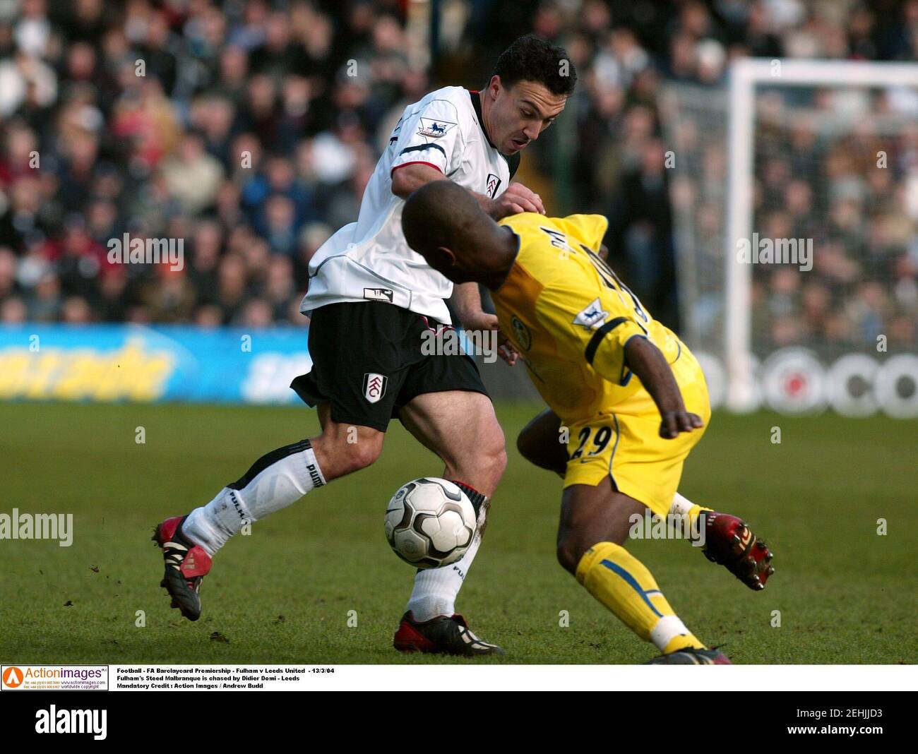 Football - FA Barclaycard Premiership - Fulham v Leeds United  - 13/3/04  Fulham's Steed Malbranque is chased by Didier Domi - Leeds  Mandatory Credit : Action Images / Andrew Budd Stock Photo