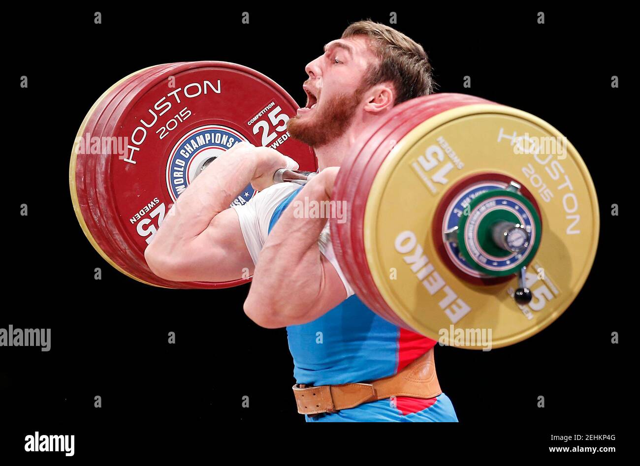 Nov 25, 2015; Houston, TX, USA; Overall bronze medalist winner Apti  Aukhadov from Russia competes in the men's 85kg group A during the  International Weightlifting Federation World Championships at George R.  Brown